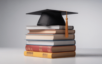 Academic books stacked with graduation cap