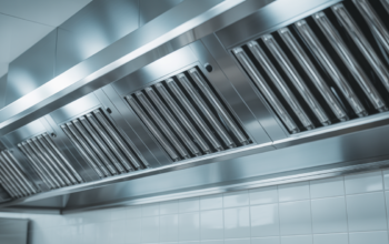 Clean and polished commercial kitchen exhaust hood after professional cleaning