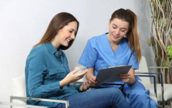 Nurse explaining medical procedure to a patient in a waiting room