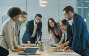 Photorealistic image of a modern collaborative office setting focused on website design professionals working together